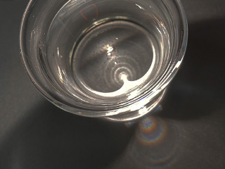 透明な容器に透明の液体を入れ、そこにライトを当てて壁に虹を映そう。